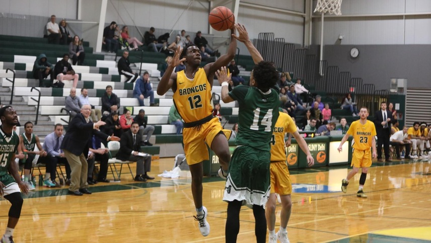 Darius Hines going up for a shot over a defender.