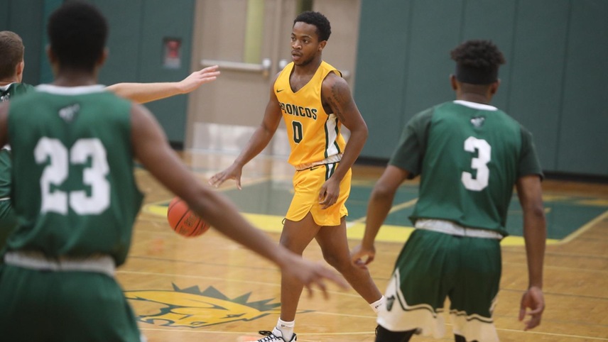 Norman Wilson dribbles the ball at the top of the key ready to call a play.