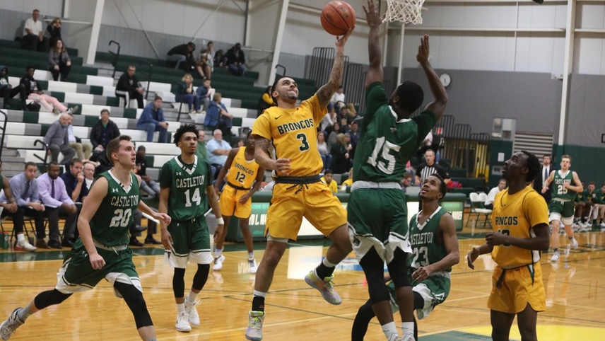 William Knight #3 contesting to score a layup with a defender in front of him.