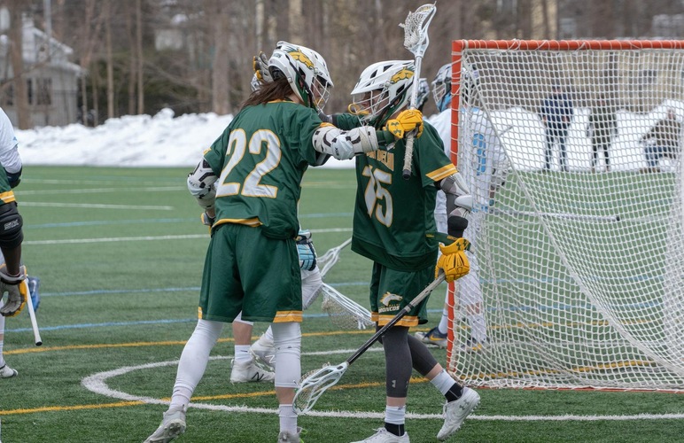 John Rohan and Brandon McGrath celebrating after a goal. 