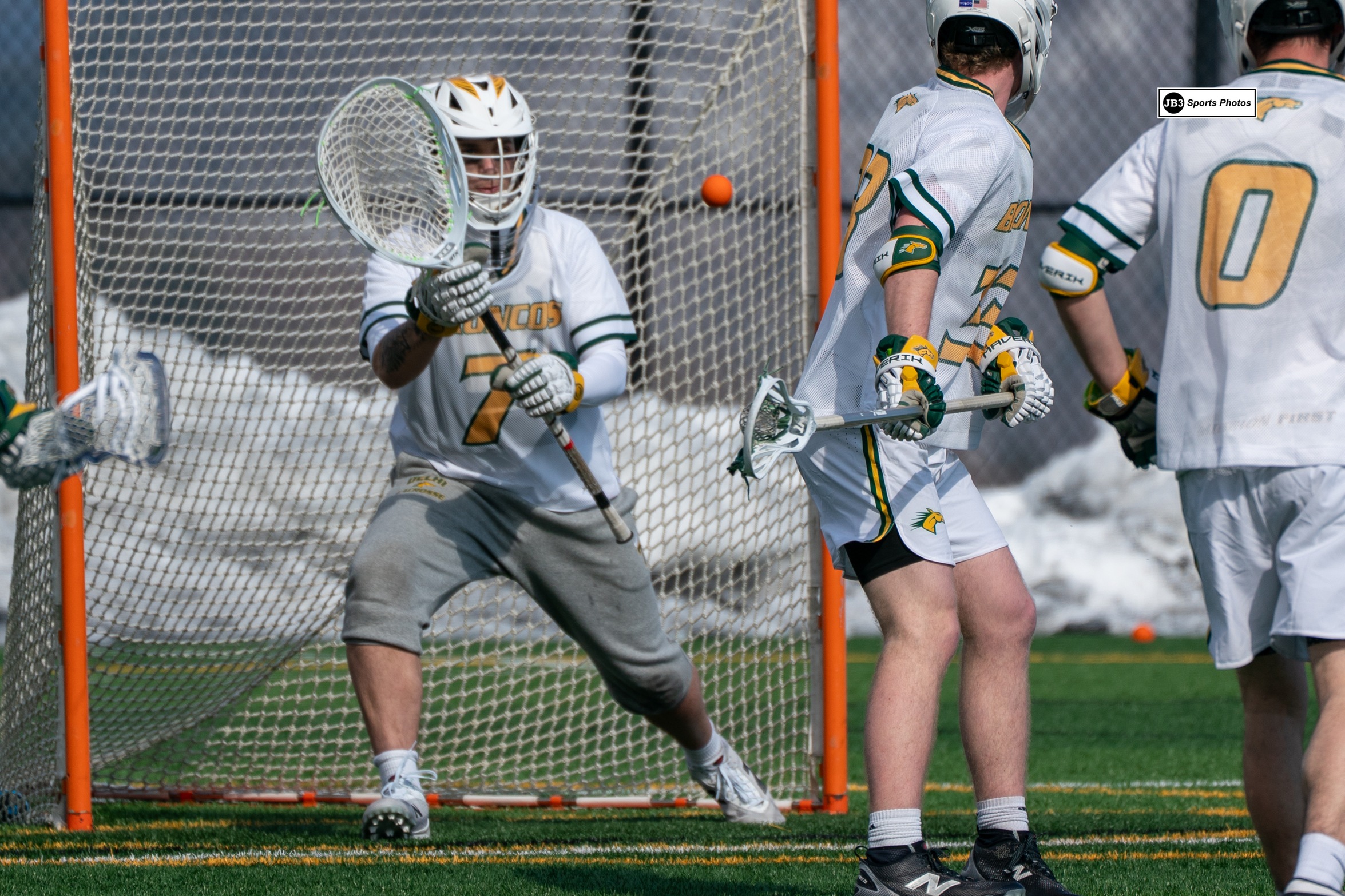 Broncos' Goalie Jayden Messina tracks incoming shot.