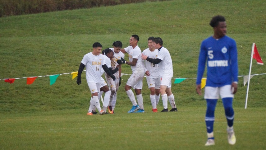 The team celebrates following scoring a goal.