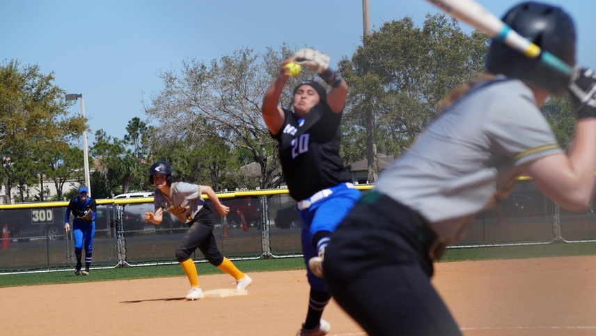 Shelby Nolan standing on second base watching the pitch play out. Sierra Keesler is batting in the foreground.