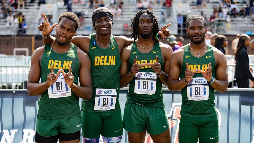 Members of 4x100 meter relay team pose for picture