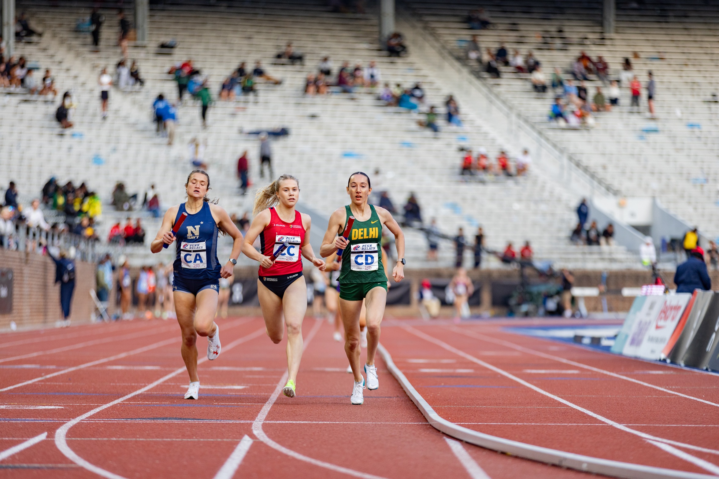 Amanda Intrieri leads runners from Navy and the University of Birmingham in the Women's Sprint Medley at the Penn Relays earlier this year.