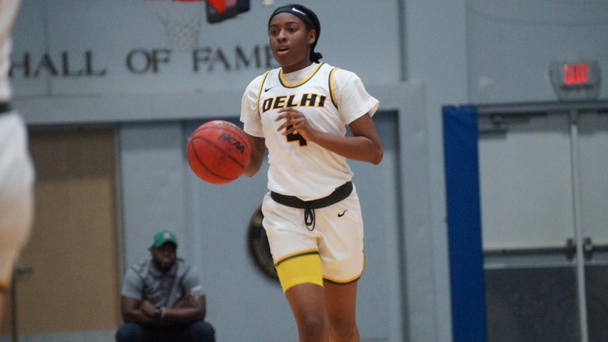 Camryn McDonald #4 bringing the ball up the court.