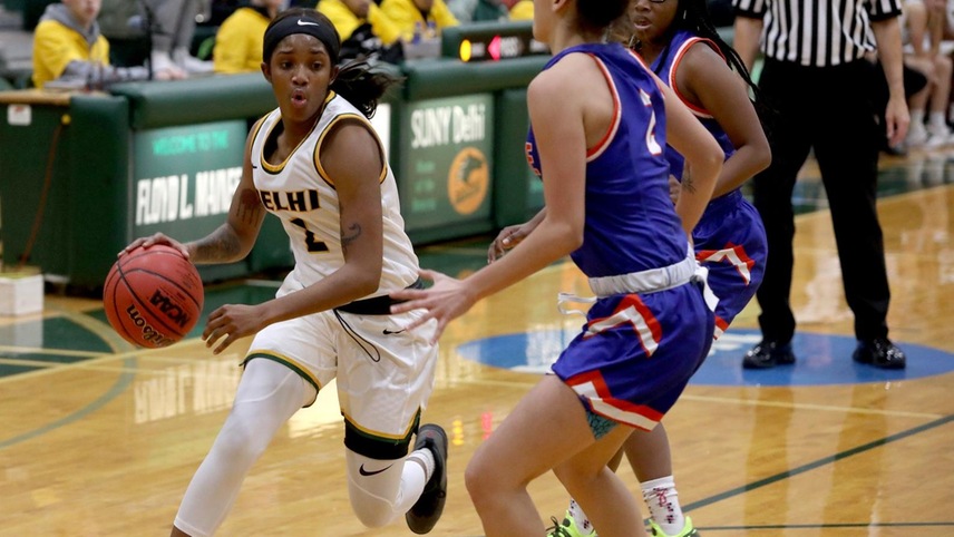 Kiera Holland driving down the lane trying to get past a defender. 