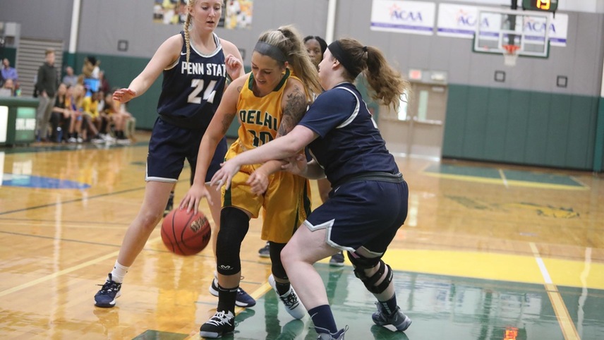 Sam Acuna fighting through a defender, while dribbling the ball.