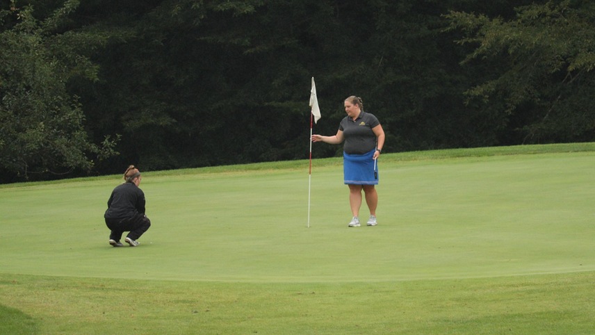 golfers on the green