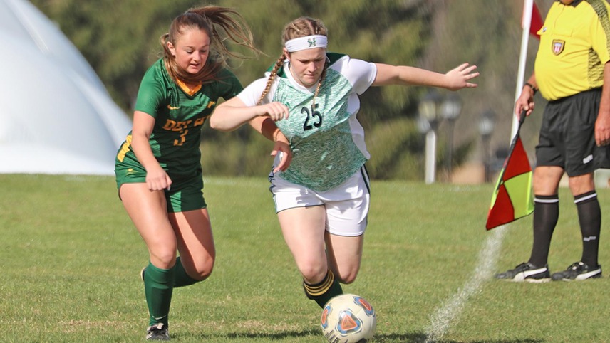 Reanen Goodspeed challenging the ball carrier near the out of bounds line.