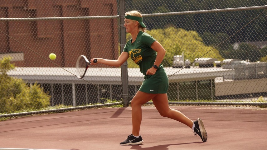 Madison Saleman returning a shot.